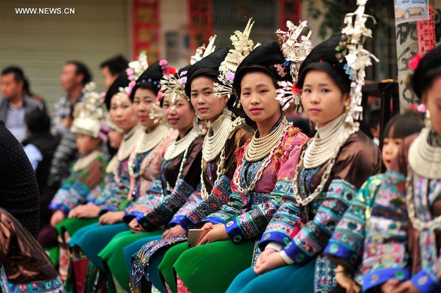 Women of Miao ethnic group attend a festival gathering to sing Miao songs at Ma'an Village of Congjiang County, Qiandongnan Miao and Dong Autonomous Prefecture, southwest China's Guizhou Province, Feb. 13, 2016. 