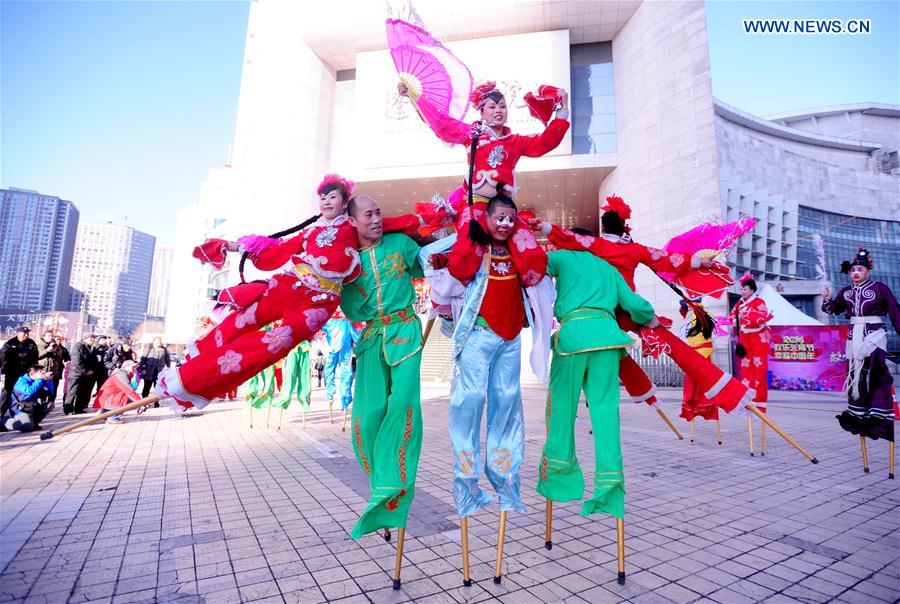 Folk actors perform stilt walking during an intangible cultural heritage show at Liaoning Grand Theater in Shenyang, northeast China's Liaoning Province, Feb. 18, 2016.