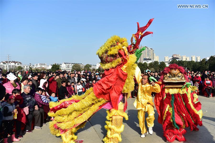 A lion dance is performed in Feixi County, east China's Anhui Province, Feb. 18, 2016.