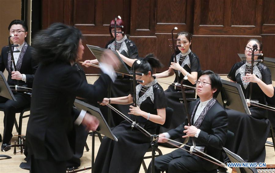 Members of China Radio Nationalities Orchestra perform during a concert at the Orchestra Hall in Detroit, the United States, Feb. 22, 2016. 