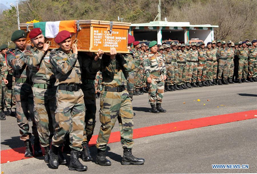 Indian Army personnel carry the coffin of Indian Army Captain Tushar Mahajan at Udhampur's military station, Indian-controlled Kashmir, on Feb. 22, 2016.