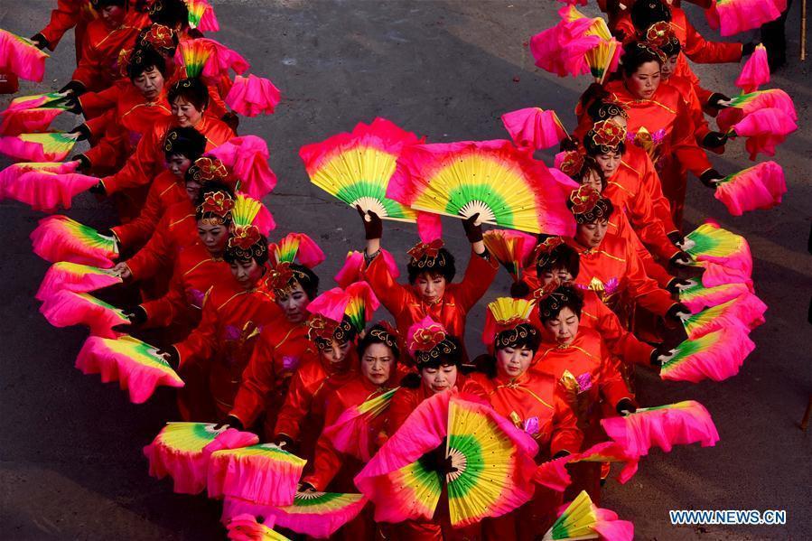 Rural folk performers dressed in traditional costume perform to celebrate the Chinese lunar New Year at a temple fair in Xunxian County of Hebi City, central China's Henan Province, Feb. 23, 2016. 