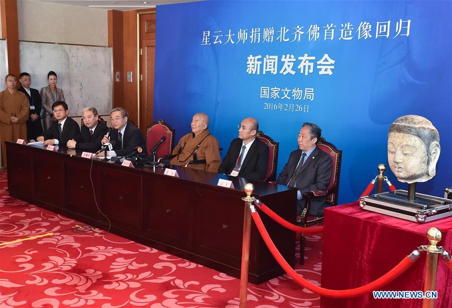 Photo taken on Feb. 26, 2016 shows the scene of a press conference on the returning of the head of an ancient Buddhist sculpture of the North Qi (550-557) period in Beijing, capital of China. 