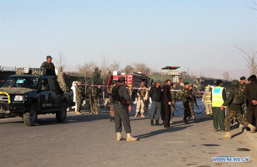 An Afghan security force member stands guard at the site of a suicide attack in Kunar province, eastern Afghanistan, Feb. 27, 2016. 