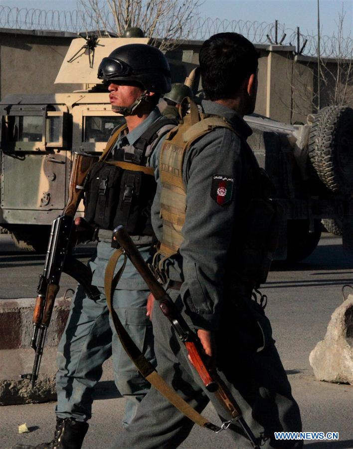 An Afghan security force member stands guard at the site of a suicide attack in Kunar province, eastern Afghanistan, Feb. 27, 2016. 