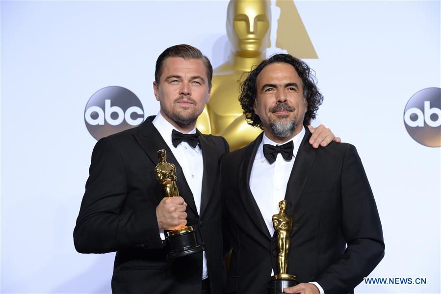 Leonardo DiCaprio (L) and director Alejandro G. Inarritu of 'The Revenant' pose after winning the best actor and best director respectively during the 88th Academy Awards in Los Angeles, the United States, on Feb. 28, 2016. 