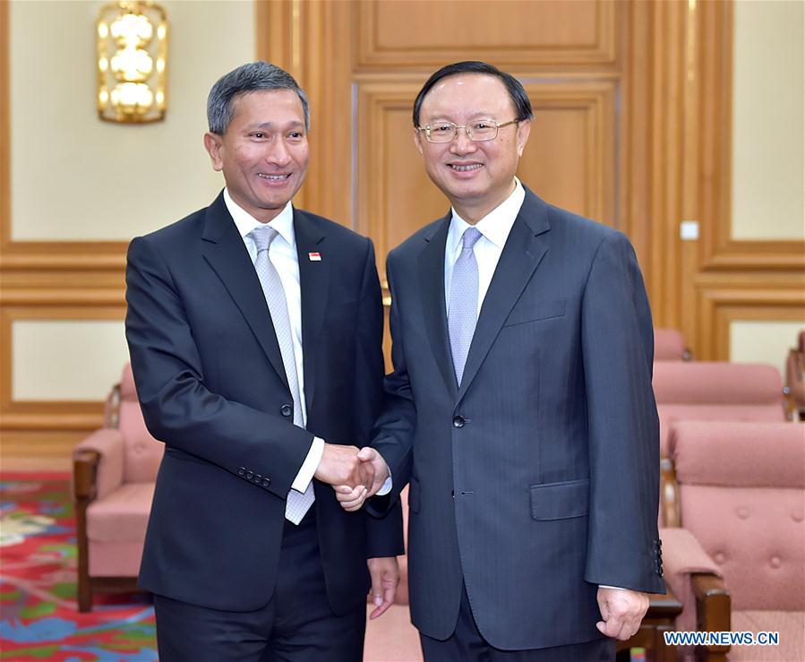 Chinese State Councilor Yang Jiechi (R) meets with Singapore's Minister for Foreign Affairs Vivian Balakrishnan in Beijing, capital of China, March 1, 2016. 