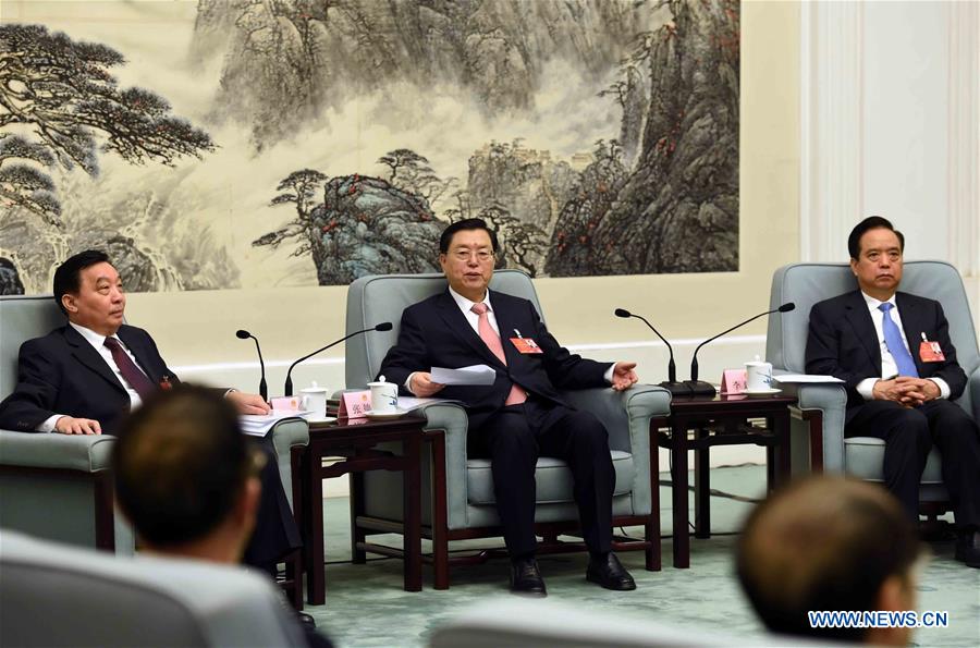 Zhang Dejiang (C), chairman of the Standing Committee of China's National People's Congress (NPC), presides over the 66th meeting of chairman and vice-chairpersons of the 12th NPC Standing Committee at the Great Hall of the People in Beijing, capital of China, March 4, 2016.