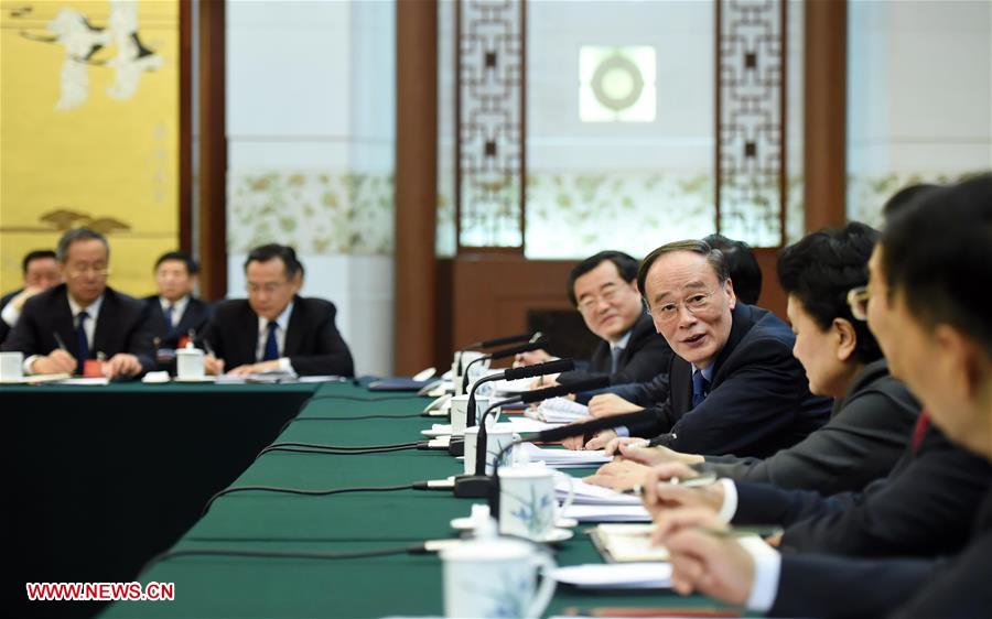 Wang Qishan, a member of the Standing Committee of the Political Bureau of the Communist Party of China (CPC) Central Committee and secretary of the CPC Central Commission for Discipline Inspection, joins a group deliberation of deputies from Hebei Province to the annual session of the National People's Congress in Beijing, capital of China, March 7, 2016. (Xinhua/Zhang Duo)