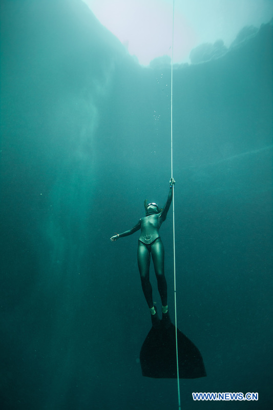 Undated file shows Sofia Gomez, Pan American champion of apnea, trains underwater for her next goal. 