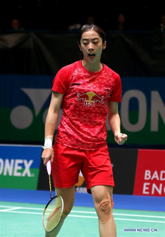 China's Wang Shixian celebrates scoring during the women's singles second round match with Beiwen Zhang of the United States at the 2016 YONEX All England Open Badminton Championships in Birmingham, Britain on March 10, 2016. 