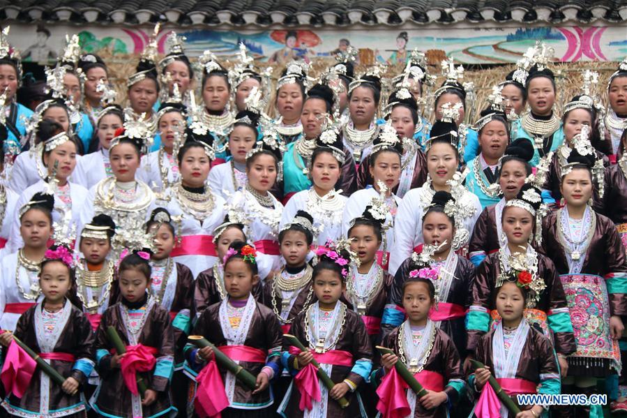  People of Dong ethnic group sing local songs to celebrate a festival blessing for good fortune in Long'e Town of Qiandongnan Miao and Dong Autonomous Prefecture, southwest China's Guizhou Province, March 16, 2016. 