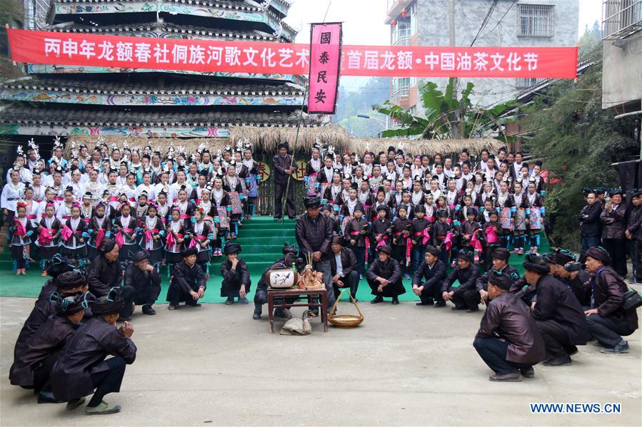  People of Dong ethnic group sing local songs to celebrate a festival blessing for good fortune in Long'e Town of Qiandongnan Miao and Dong Autonomous Prefecture, southwest China's Guizhou Province, March 16, 2016. 