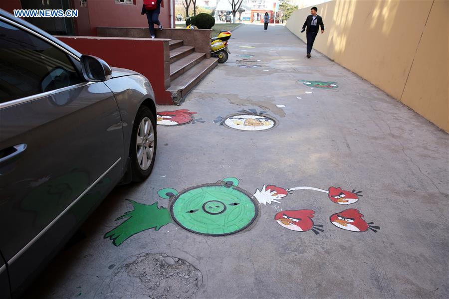 #CHINA-SHANDONG-QUFU-CARTOON MANHOLE COVERS (CN)