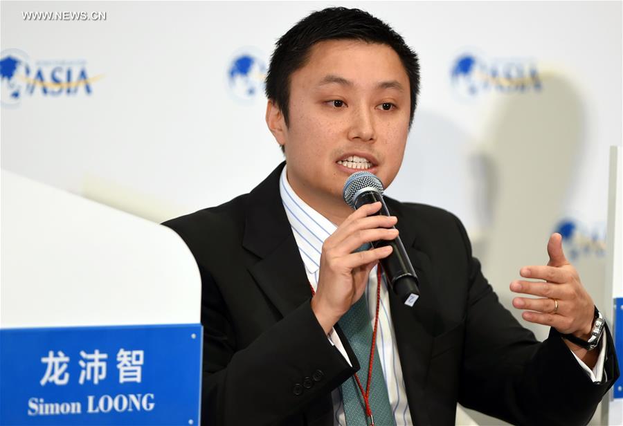 Simon Loong, CEO of wolaidai.com, a p2p Internet banking company, speaks on a session of Internet Banking in the annual Boao Forum for Asia (BFA) in Boao, south China's Hainan Province, March 22, 2016.