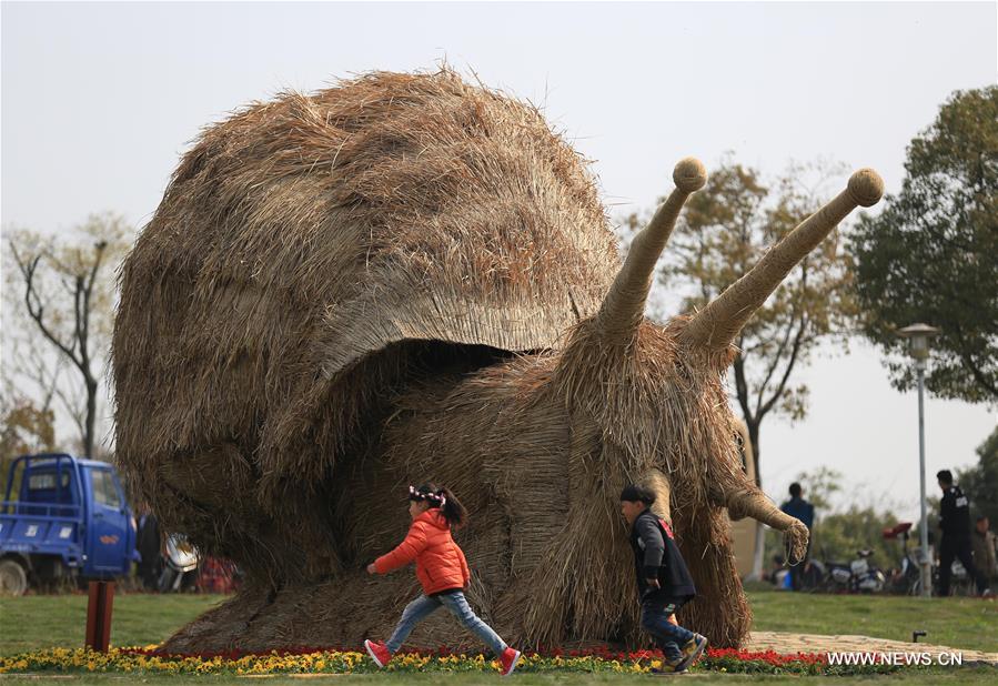 Photo taken on March 26, 2016 shows a straw-made mantis during a tourism festival in Nanjing, capital of east China's Jiangsu Province.