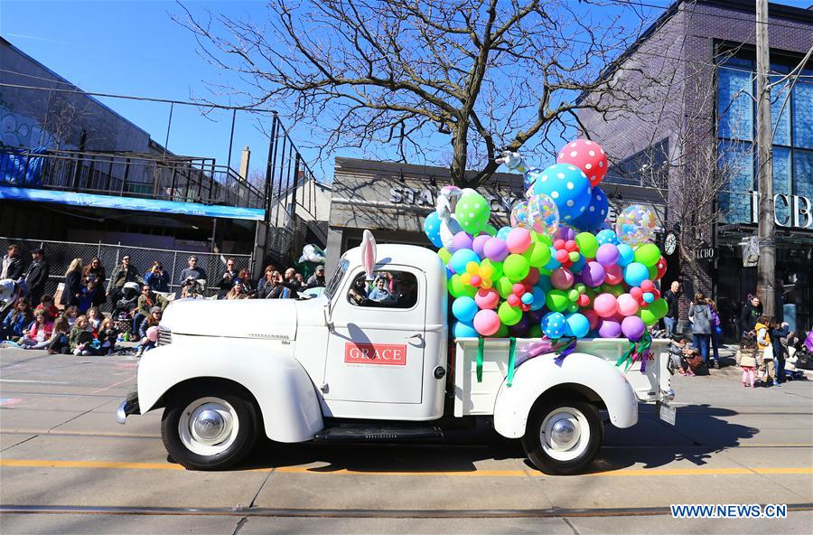 A reveller makes soap bubbles during the 2016 Toronto Beaches Lions Easter Parade in Toronto, Canada, March 27, 2016.