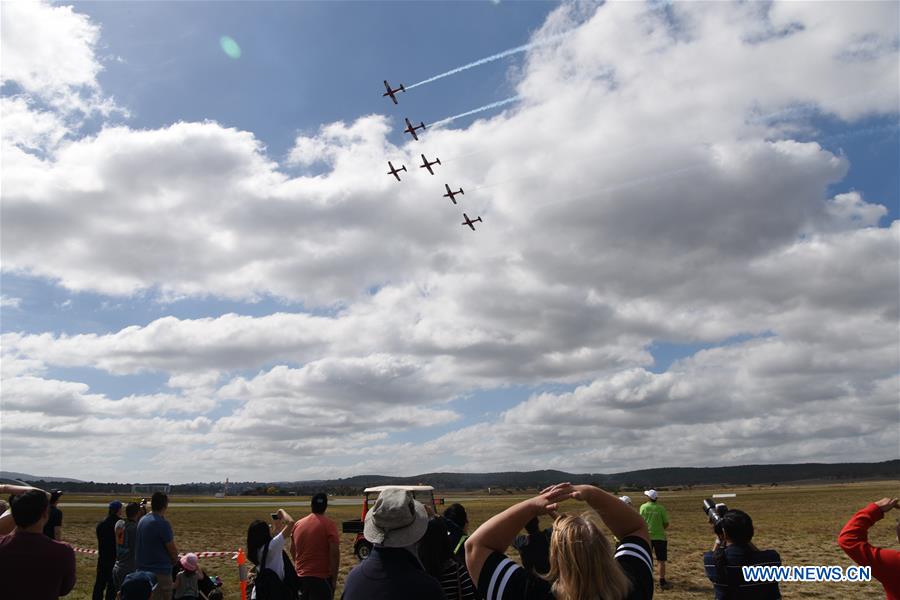 Royal Australian Airforce's Roulettes formation aerobatic display team perform during the Canberra Airport Open Day in Canberra, Australia, April 3, 2016.