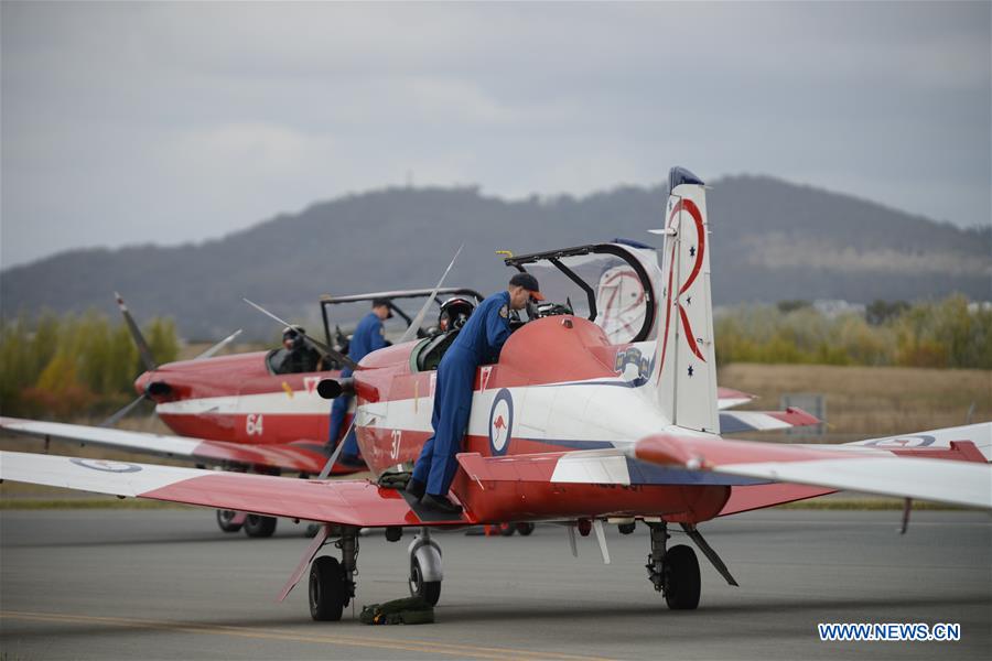 Royal Australian Airforce's Roulettes formation aerobatic display team perform during the Canberra Airport Open Day in Canberra, Australia, April 3, 2016.