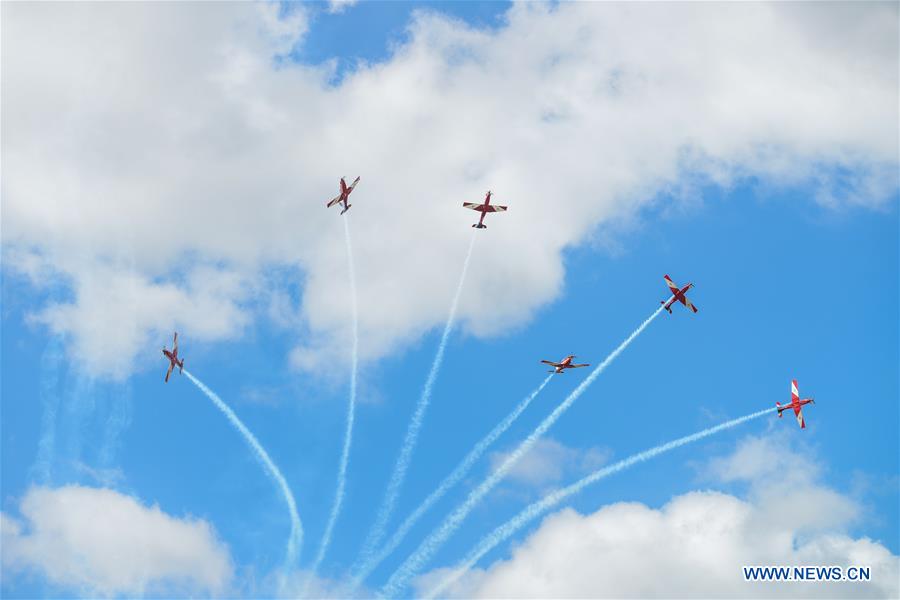 Royal Australian Airforce's Roulettes formation aerobatic display team perform during the Canberra Airport Open Day in Canberra, Australia, April 3, 2016.