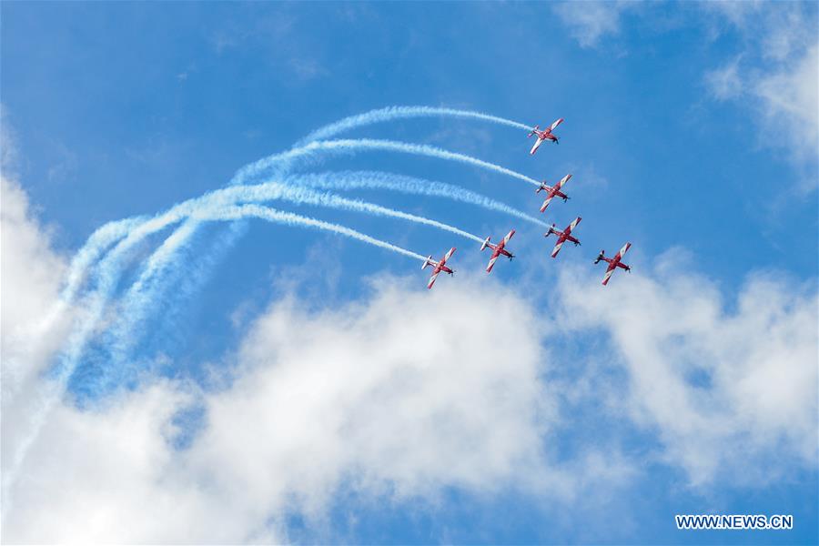 Royal Australian Airforce's Roulettes formation aerobatic display team perform during the Canberra Airport Open Day in Canberra, Australia, April 3, 2016.