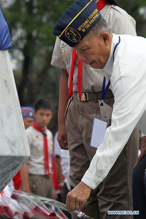 TAGUIG CITY, April 5, 2016 (Xinhua) -- A Filipino World War II veteran offers a rose on the Tomb of the Unknown Soldier as he participates in the ceremony marking the start of the Philippine Veterans Week in Taguig City, the Philippines, April 5, 2016. The Philippine Veterans Week will recognize the remaining 9,500 Filipino World War II veterans, 45 of which will be honored with awards by the Philippine government for their service during the war time. (Xinhua/Rouelle Umali) 