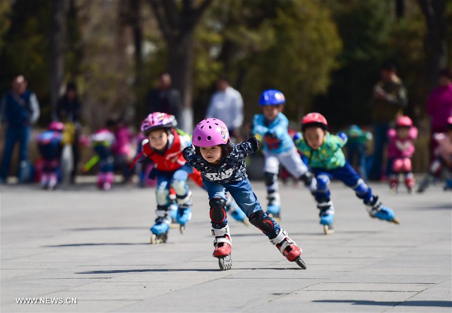 Children practise roller skating at Qingcheng Park in Hohhot, north China's Inner Mongolia Autonomous Region, April 9, 2016.