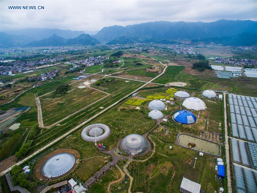 An aerial photo taken on April 9, 2016 shows dome greenhouses in Tiantai County, east China's Zhejiang Province. 