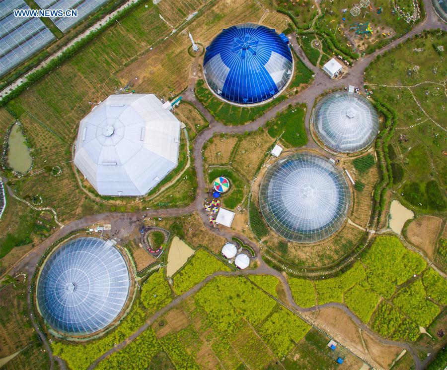 An aerial photo taken on April 9, 2016 shows dome greenhouses in Tiantai County, east China's Zhejiang Province.