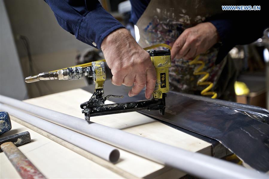 Mariani fixes the lead sheet on the board at his studio in Milan, Italy, on April 13, 2016.