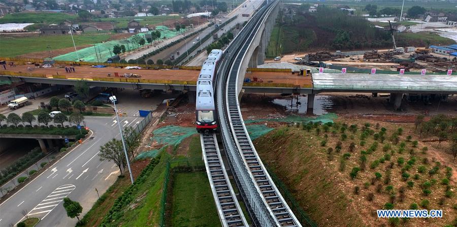 A train runs on the magnetic levitation line in Changsha, capital of central China's Hunan Province, May 5, 2016.