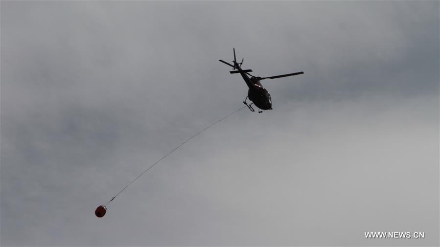  The massive wildfire in Alberta Province has covered more than 2,000 square kilometers by Saturday and forced almost 100,000 residents to evacuate.