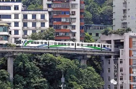 A light rail route was built between two residential buildings. 'What does it feel like to jump out of the window and catch the train every day,' teased one netizen. [Photo: Wechat]