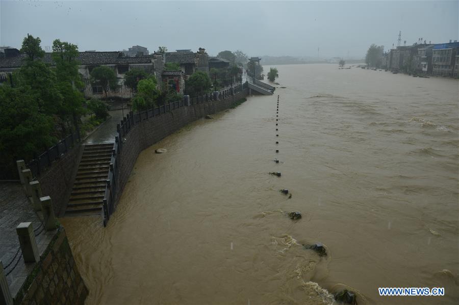 A street is inundated with floods in Lichuan County, east China's Jiangxi Province, May 9, 2016. 