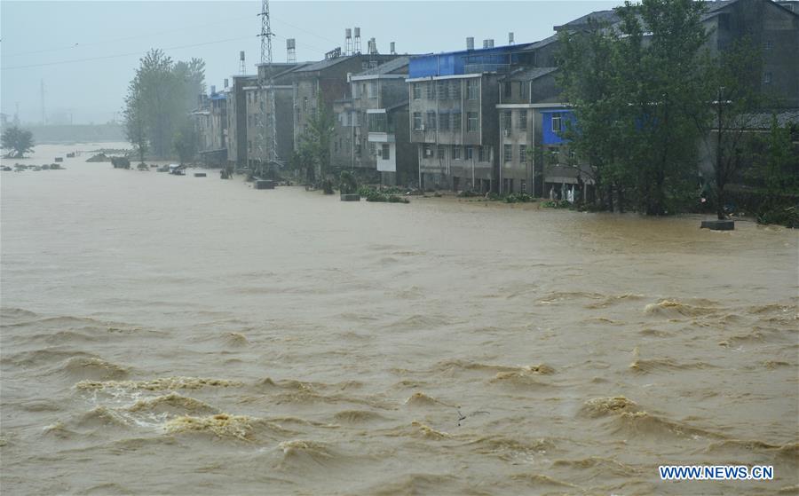 Residential buildings are inundated with floods in Lichuan County, east China's Jiangxi Province, May 9, 2016. 