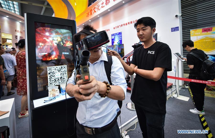 Visitors try the games with virtual reality (VR) devices at the 12th China (Shenzhen) International Cultural Industries Fair in Shenzhen, south China's Guangdong Province, May 13, 2016.