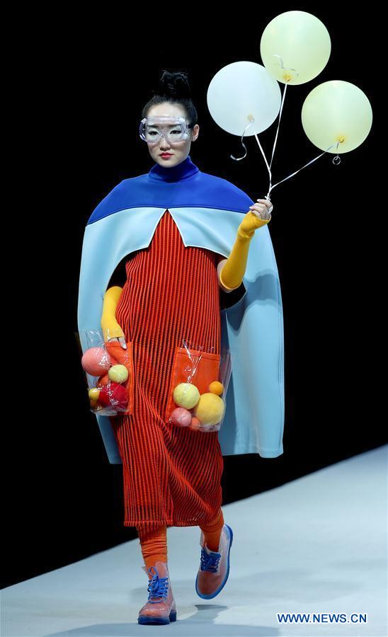 A model shows a creation of graduates from the Southwest University during the China Graduate Fashion Week in Beijing, capital of China, May 17, 2016. 