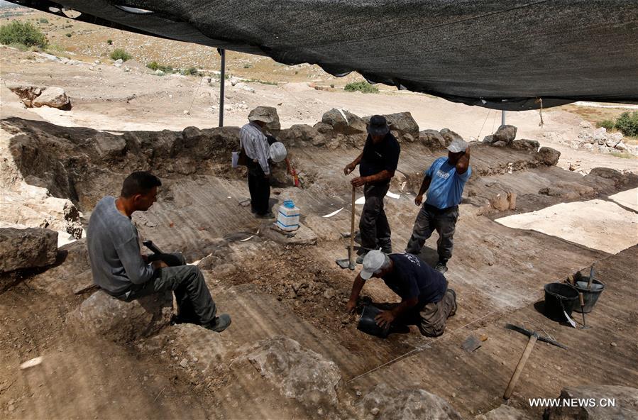 Israeli archeologists said on Tuesday they have unearthed a 'rare' trove of silver coins that a Jewish farmer stashed outside his home west of Jerusalem some 2,140 years ago.