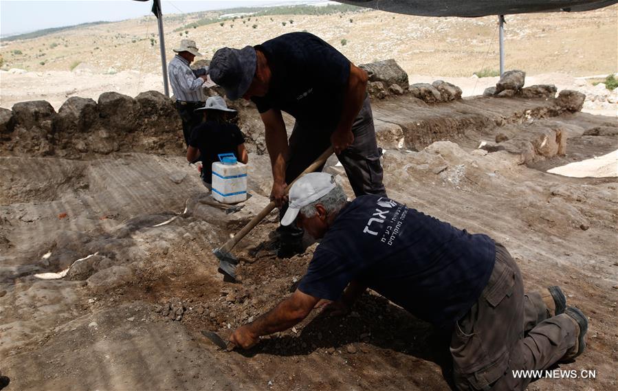 Israeli archeologists said on Tuesday they have unearthed a 'rare' trove of silver coins that a Jewish farmer stashed outside his home west of Jerusalem some 2,140 years ago.