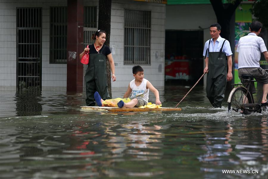 Flood caused by heavy rain forced local residents to relocate on Tuesday.