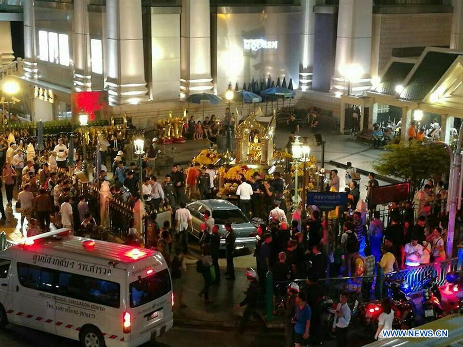 Police investigate the crashed sedan on the scene at the Erawan Shrine in central Bangkok, Thailand, July 22, 2016. 