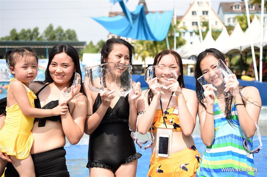 With highest temperature reaching 40 degrees Celsius, local meteorological authorities on Tuesday issued a red alert for high temperatures, urging people to reduce outdoor activities