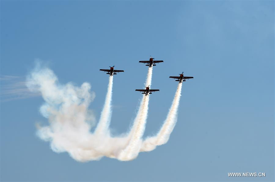 Planes take part in the aerobatics performance at an international general aviation convention in Zhangye City, northwest China's Gansu Province, Aug. 26, 2016.