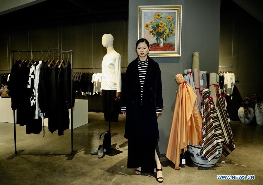 A model presents a creation of designer Zhang Yichao at an inauguration ceremony of an incubator of fashion and innovative talents in Hangzhou, capital of east China's Zhejiang Province, March 17, 2017. The talents incubator is jointly developed by fashion college of Zhejiang Sci-tech University, School of Fashion of Wuhan Textile University and a customization platform. (Xinhua/Chen Jianli) 