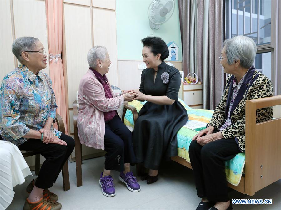 Wife of Chinese president visits elderly center in Hong Kong