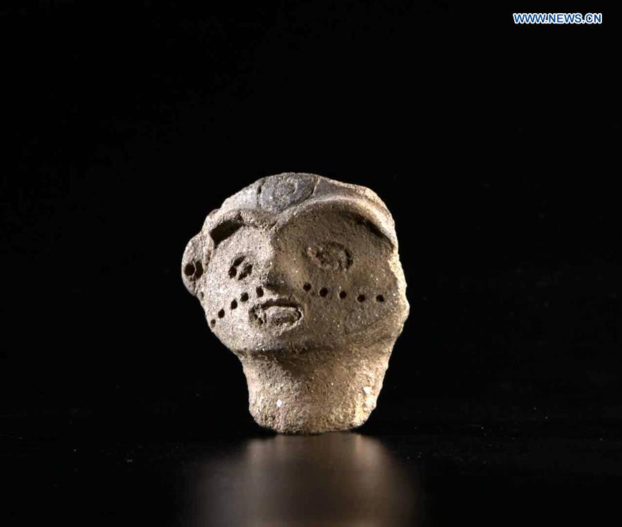 Xinhua Headlines: Mysterious female pottery face sends 7,300 year-old smile