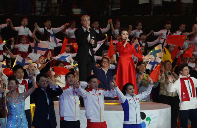 Chinese and Finnish singers sing Long Live Friendship along with all the performers and athletes attending the China-Finland Year of Winter Sports opening ceremony on Jan 15, 2019 in Beijing. [Photo: China Plus]