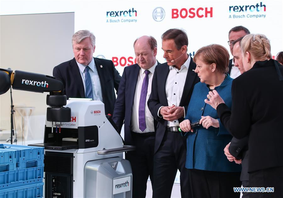 German Chancellor Angela Merkel (4th L) visits the booth of Bosch Rexroth during the 2019 Hanover Fair in Hanover, Germany, on April 1, 2019. With a total of 6,500 exhibitors from 75 countries and regions, the Hanover Fair shows the latest development of technologies for industrial use, including 5G network, artificial intelligence, light-weight manufacturing among others. (Xinhua/Shan Yuqi)