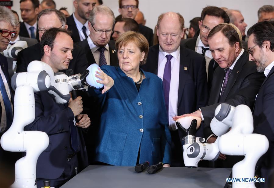 German Chancellor Angela Merkel (front C) and Swedish Prime Minister Stefan Loefven (2nd R, front) visit the booth of FRANKA EMIKA during the 2019 Hanover Fair in Hanover, Germany, on April 1, 2019. With a total of 6,500 exhibitors from 75 countries and regions, the Hanover Fair shows the latest development of technologies for industrial use, including 5G network, artificial intelligence, light-weight manufacturing among others. (Xinhua/Shan Yuqi)