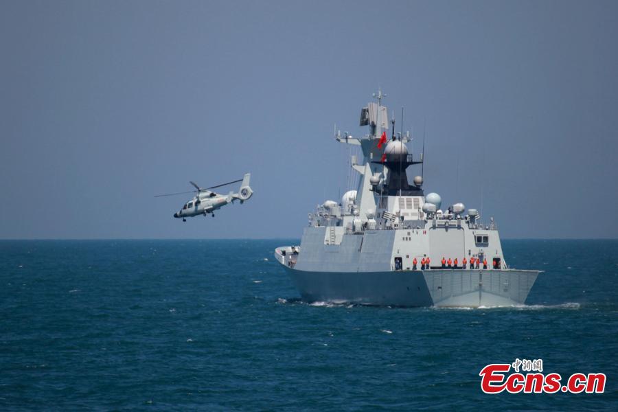 A helicopter takes off from a Chinese naval vessel during a joint naval exercise on the sea off Qingdao, east China\'s Shandong Province, April 26, 2019. China conducted a joint naval exercise with Southeast Asian countries in Qingdao, with focus on jointly handling maritime emergency rescues. （Photo: China News Service/Li Chun）